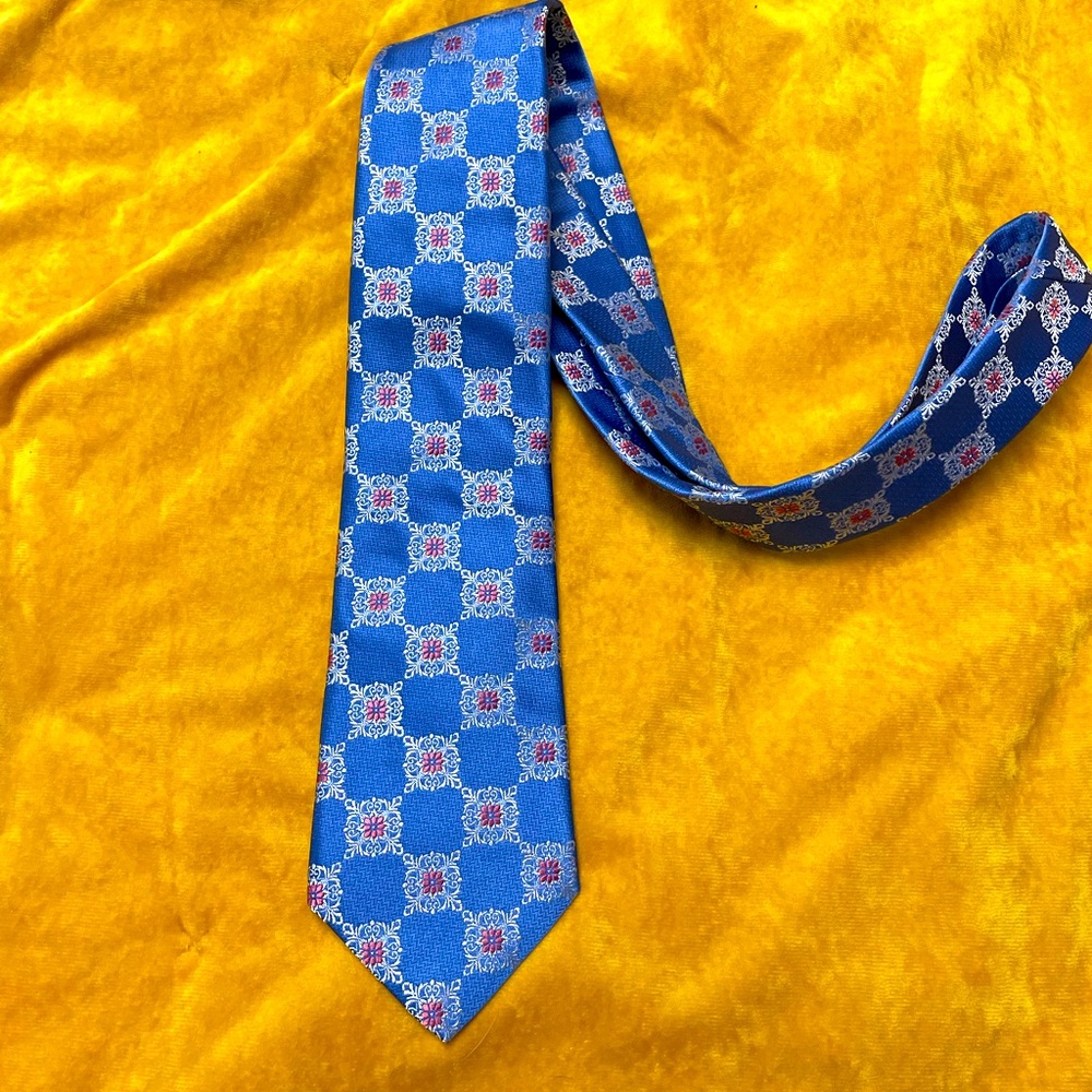 New Ike Behar tie.  Blue with white and pink accents. 100% silk.